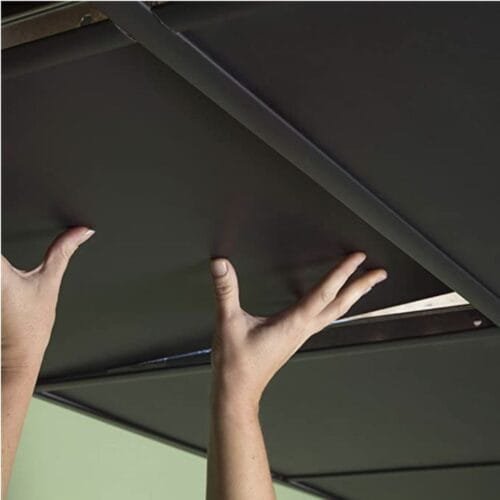 Black polyester fiber acoustic grid ceiling tiles installed in a modern office, reducing noise and improving sound quality. STUDIO ACOUSTICS